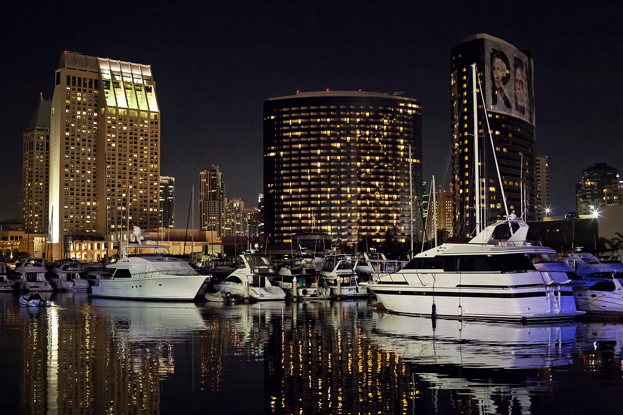 San Diego skyline at night with sailboats in the foreground