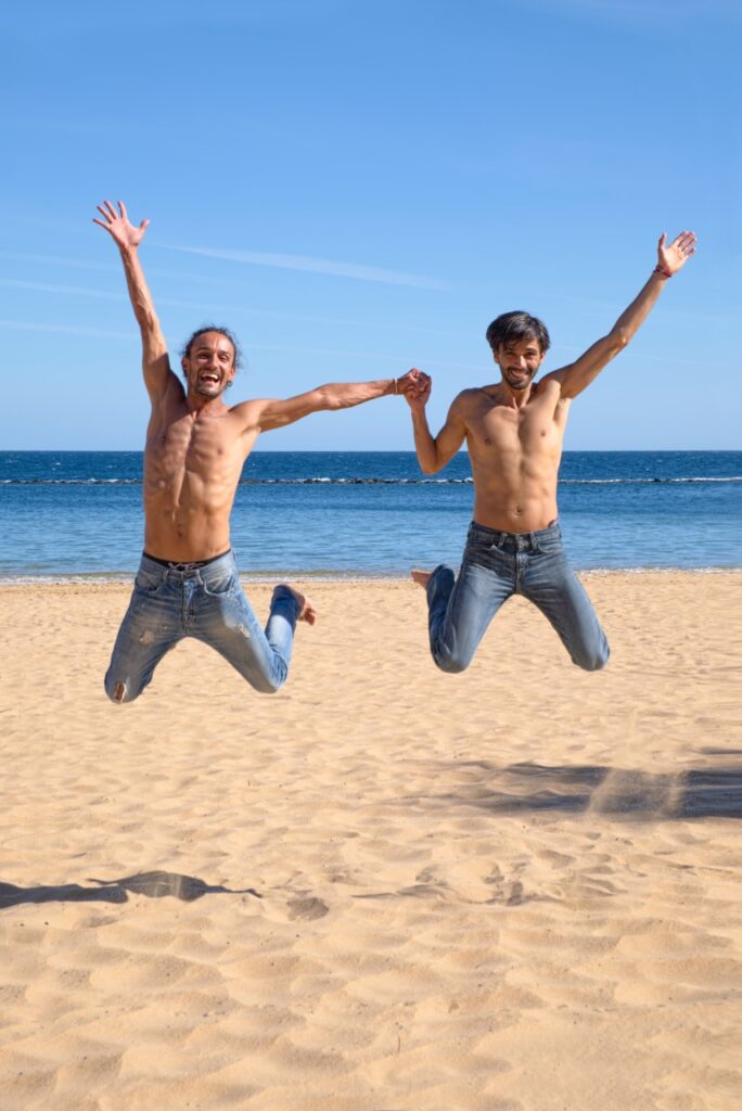 happy gay couple at the beach