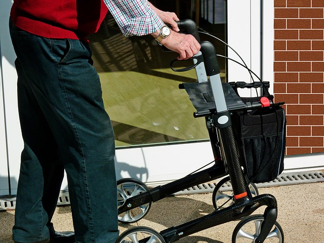 elderly man using a rolling walker
